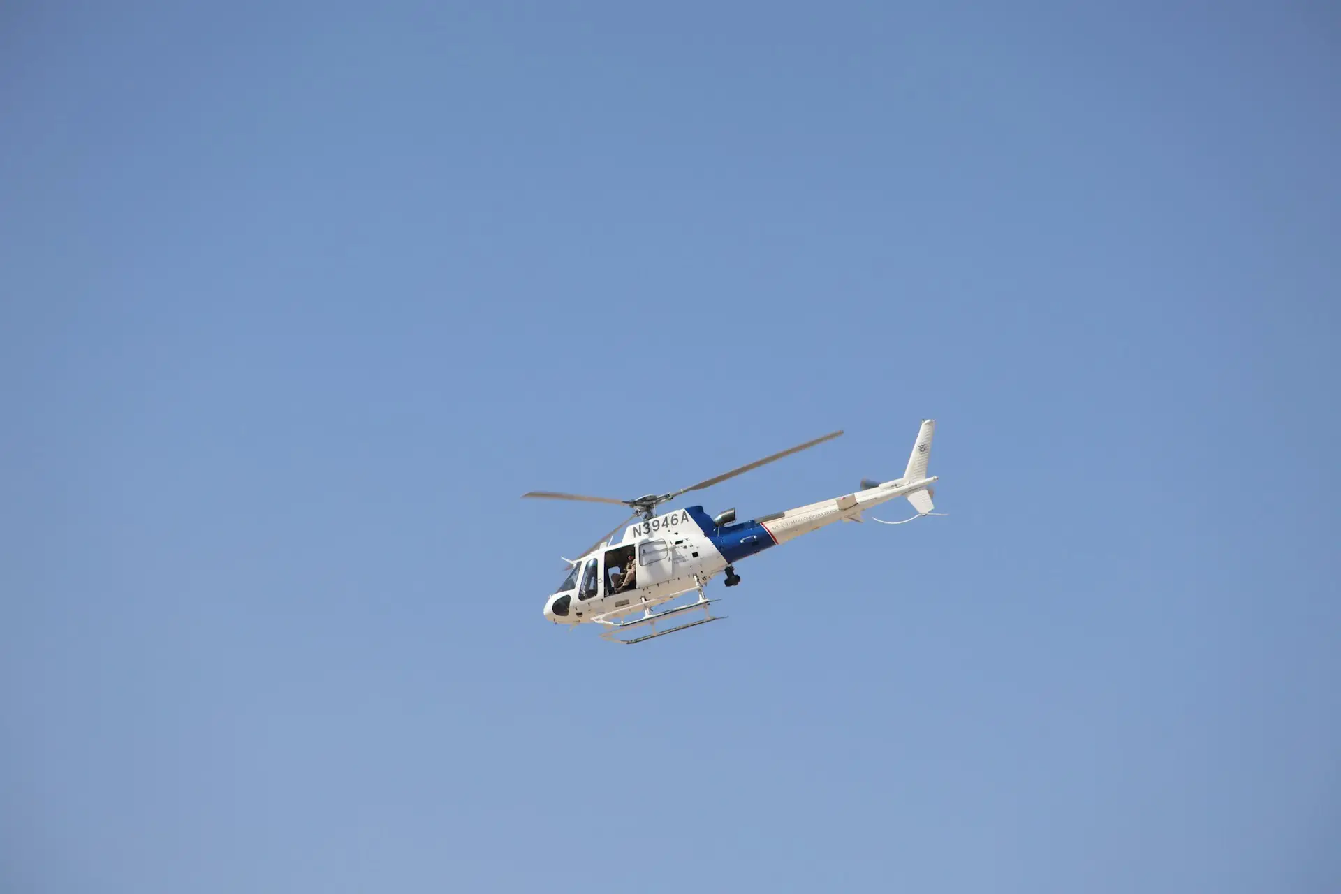 Airbus helicopter flying with blue sky in the background