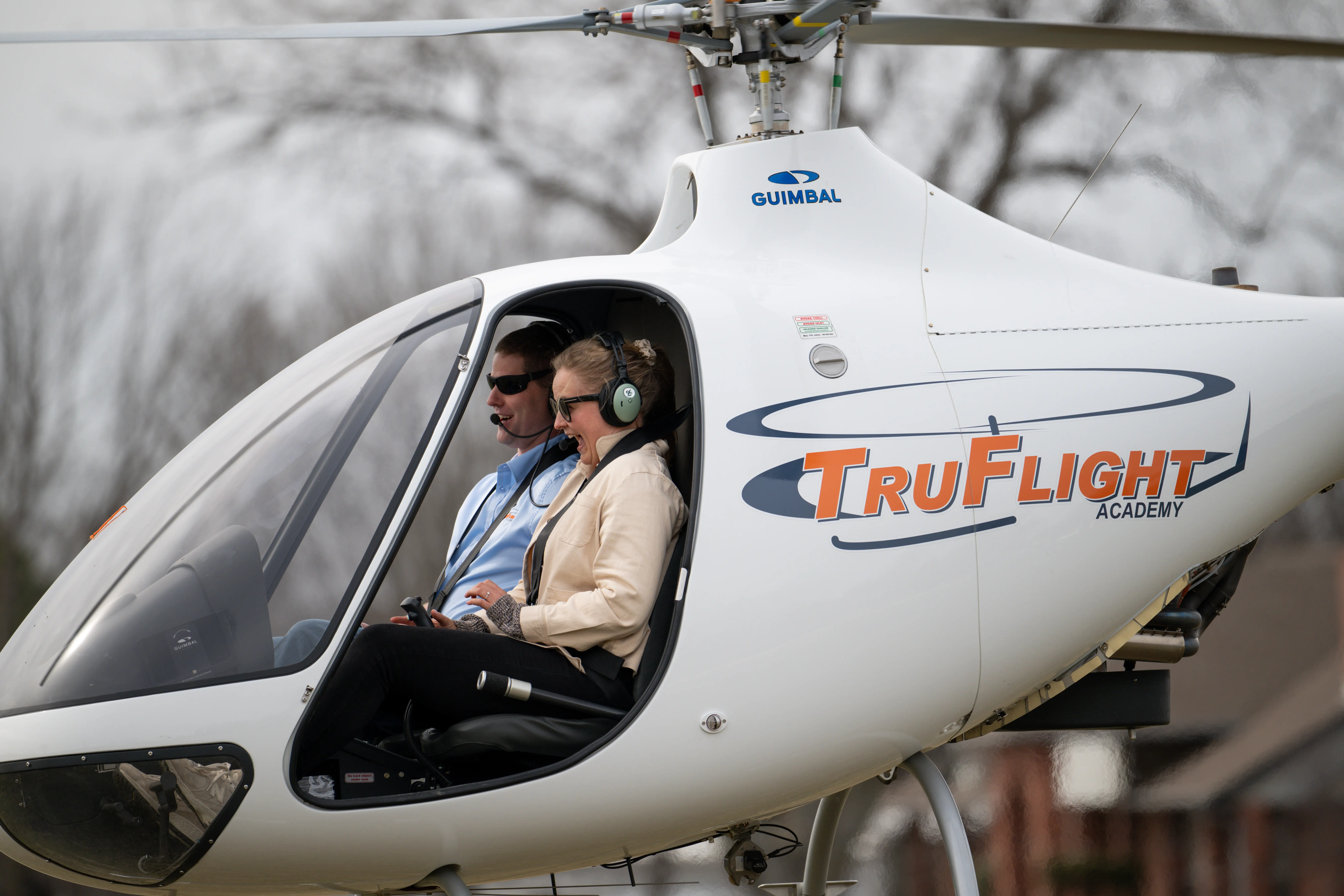 Excited pilot in helicopter seen from the left